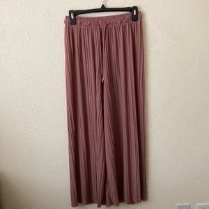 pants with adjustable waist straps.